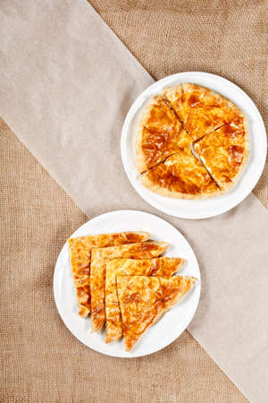 georgian traditional khachapuri on plate on canvas background. Asian national meal