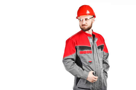 man wearing overalls with red helmet on white backgroundの写真素材