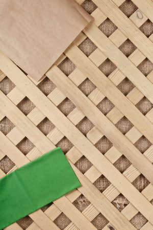 wooden cross backgroung with canvasの写真素材