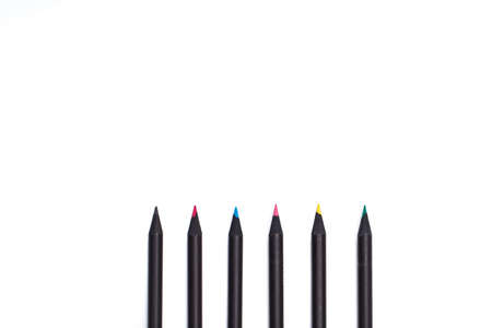 twelve black parallel pencils stay together on white background. close-up view. isolated imageの写真素材