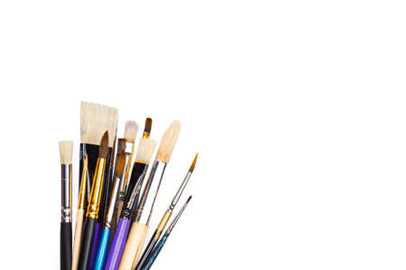 Set of artist paint brushes on white background with much space for text. Isolated image.の写真素材