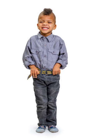 Stylish black kid smiles shyly.の写真素材