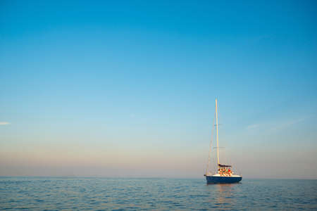Sea voyage on a sailing yacht. Calm on the sea. Walk on a yacht on the ocean. Cruise on a yacht. Young people is resting on the sailing yacht. Sailing yacht at sea. Yachting.の写真素材