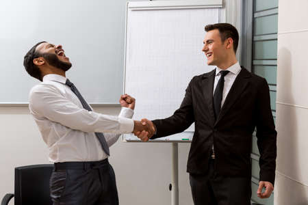 Clerks pleased the business transaction. Success of two partners.