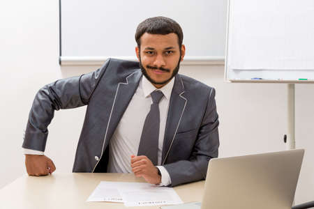 Producer sitting in his office. Businessman in office.