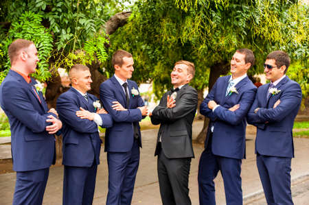 Ukraine, Odessa 07.09.2013. Friends of the groom are joking and laughing.のeditorial素材