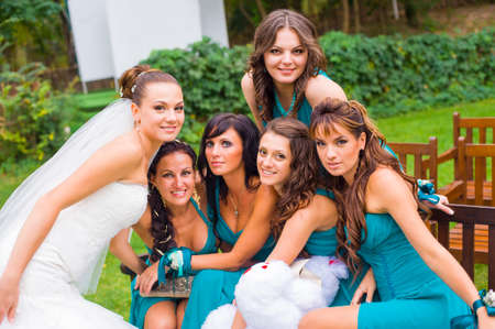 Ukraine, Odessa 07.09.2013. The bride and five bridesmaids are sitting in the garden and waiting for ceremony.のeditorial素材