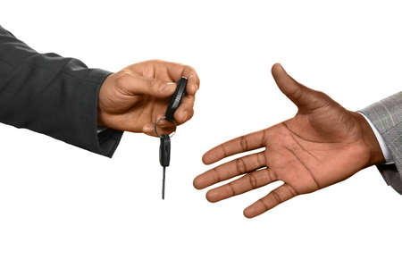 Man handing car keys. Trust me. Close to luxury. Moving with comfort.
