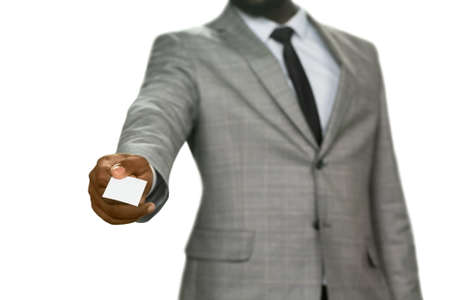Darskinned manager gives visit card. Let me introduce myself. Detective at your service. An...
