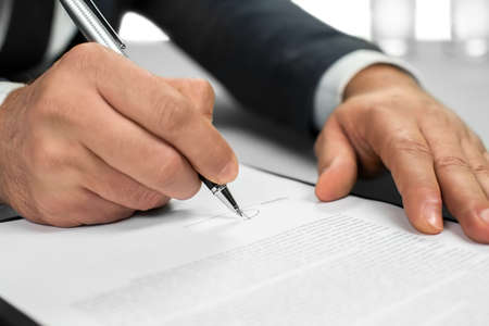 Businessman at work. Lawyer's paperwork. Read carefully. Making conclusions.
