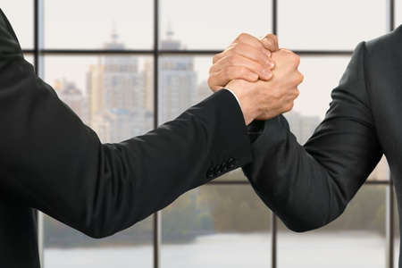 Businessmen strong and friendly handshake.の写真素材