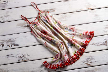 Vintage floral sarafan on display. Sarafan in the wind. Piece of woman's summer clothing. Light flax sarafan for summer.の写真素材