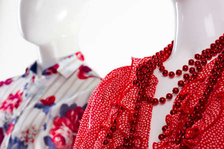 Shirt and necklace on mannequin. Mannequins in classy apparel. Summer clothing for young people. Fashion clothes for modern youth.の写真素材