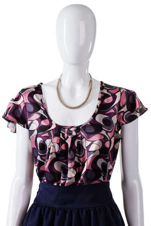 Mannequin wearing blouse and jewelry. U-neck blouse with precious necklace. Lady's casual dark top. Dark female outfit and necklace.の写真素材