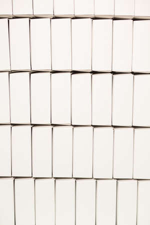 Rows of blank white boxes. Lots of plain boxes. Environmentally friendly material. Simple design of packaging.の写真素材