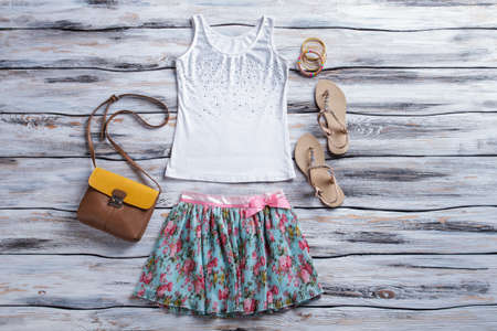 White tank top and skirt. Skirt, tank top and sandals. Lady's footwear and accessories. Best price...
