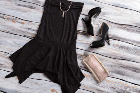 Black sleeveless dress with shoes. Small silver purse and jewelry. Exclusive custom-made necklace. Most expensive merchandise.の写真素材