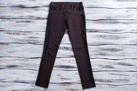 Black skinny fit trousers. Dark-colored female pants. Pants of cotton and stretch. Clothing made of...