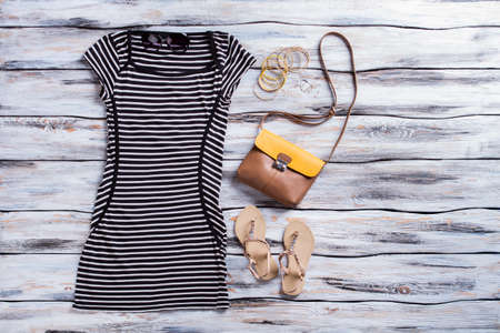 Striped black dress and sandals.の写真素材