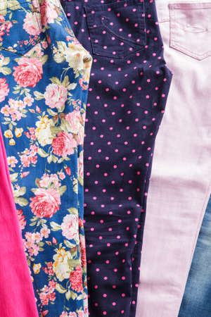 Bright floral and navy trousers.の写真素材