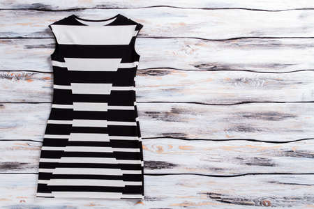 Casual black and white Sleeveless dress on wooden background.の写真素材