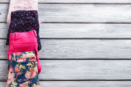 Casual trousers of different color. Folded pants with print.の写真素材