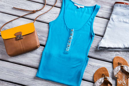 Blue tank top and purse. Bicolor bag and flip flops.の写真素材