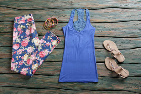 Blue tank top and pants. Sandals with top and trousers.の写真素材