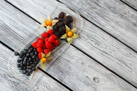 Blueberry and raspberry on plate.の写真素材