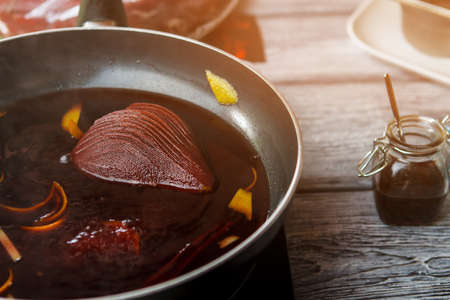 Pear with liquid on pan.の写真素材