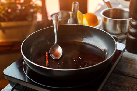 Pan with liquid and spoon.の写真素材