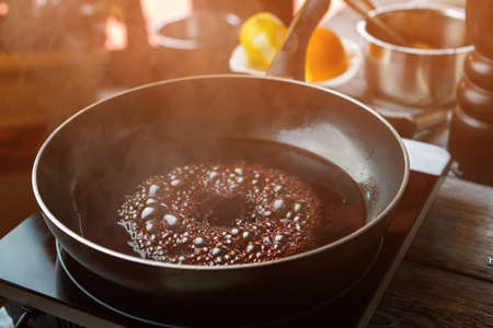 Frying pan with boiling liquid.の写真素材