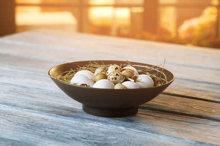 Whole eggs lying in bowl. White chicken eggs. Fresh organic product. Key ingredients for an omelet.の写真素材