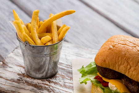 Bucket with fries and burger.の写真素材
