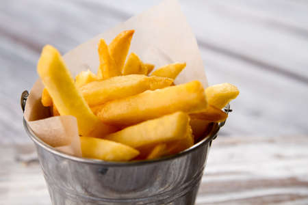 Bucket with yellow fries.
