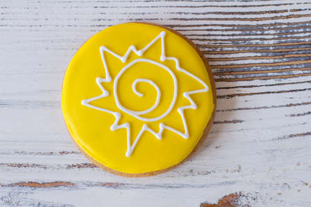 Top view of decorated cookie. Biscuit with bright icing. You can touch the star. Crispy dessert on white table.の写真素材