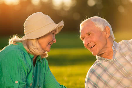 Senior man looking at woman. Elderly couple is smiling. You keep surprising me. Value of feelings.