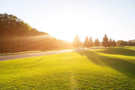 Nature and road. People on bikes. Perfect place to spend summer. Spinning the pedals.の写真素材
