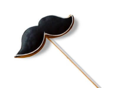 Cookie in shape of moustache. Biscuit with black icing. Dessert for true gentleman. Taste and...