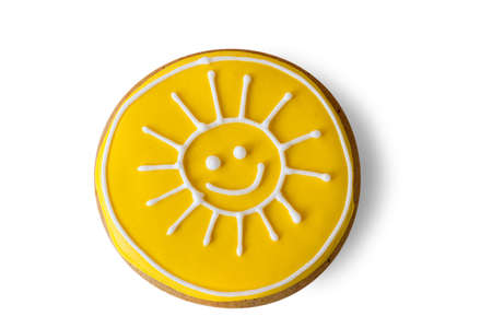 Cookie with a painting. Icing of bright yellow color. Let the sun shine brighter. Charge of good mood.の写真素材