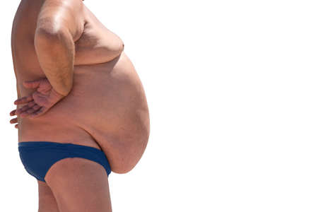 Side view of obese man. Isolated overweight male. Sedentary lifestyle and poor diet. High risk of heart illnesses.の写真素材