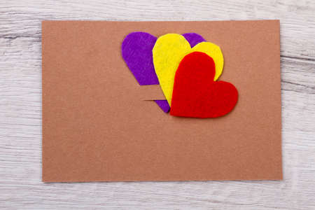 Mockup of greeting card. Hearts on top of card . Examples of paper congratulations. Send love and...