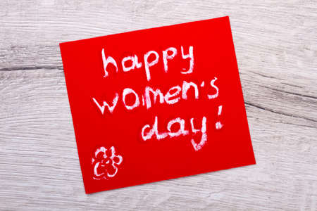 Happy Women`s Day mockup card. Greeting card on wooden backdrop. Receive ideas for handmade. Make...