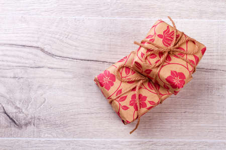 Gift paper wrapped boxes. Present boxes with rope bow. Prepare gifts for beloved people. Happiness all around.の写真素材