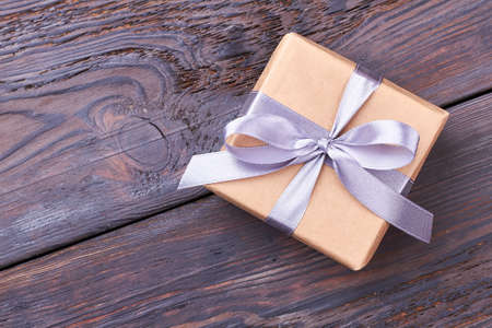 Wrapped gift box with bow. Ribbon on present box. Gift for the long memory.の写真素材