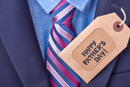 Father's Day tag and suit. Label near tie on jacket. Shopping for daddy.の写真素材