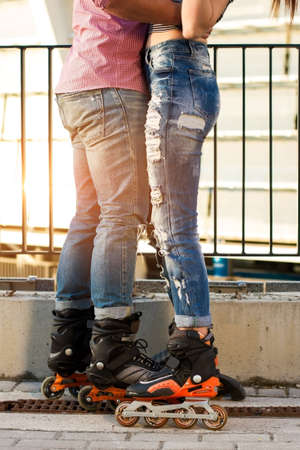 Couples legs on inline skates. Woman and man in jeans. Sport and style.の写真素材
