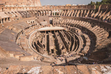 Colosseum and people. Ancient building at daytime. Beauty and might of architecture.の写真素材