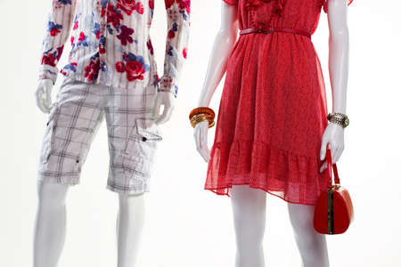 Sarafan and shorts on mannequins. Mannequins in light cotton apparel. Sale for men and women. Low prices for summer clothing.の写真素材