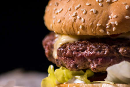 Close-up of burger. Piece of grilled meat. Incredible taste you wont forget.の写真素材
